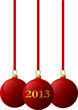 Три красных новогодних шарика, на среднем надпись 2013.