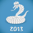 Белая королевская кобра в короне и надпись 2013. Змея выполнена в технике оригами, фон - голубой